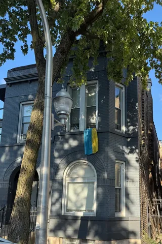 a view of a house with a tree