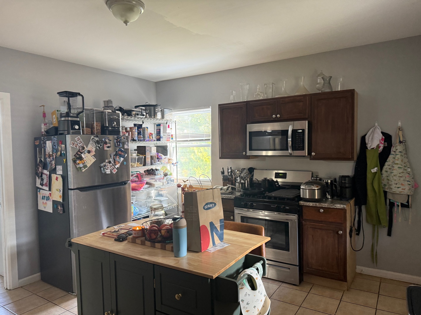 827 North Fairfield Avenue Chicago, IL 60622 - Photo 26 of 55 a kitchen with stainless steel appliances granite countertop a sink stove and refrigerator