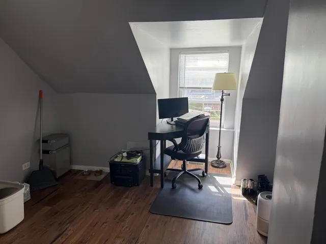 a bedroom with a bed and a view of bathroom
