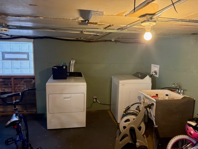 a bathroom with a tub and sink