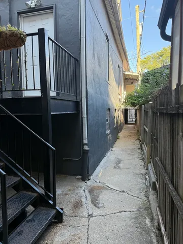 a room with furniture and gym equipment