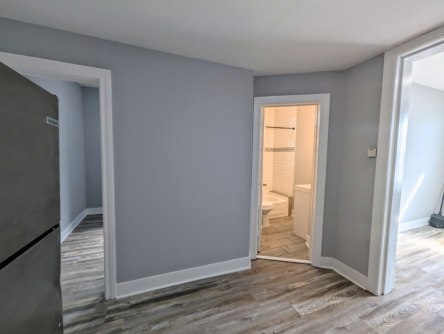 827 North Fairfield Avenue Chicago, IL 60622 - Photo 48 of 55 a view of an empty room with wooden floor and a window