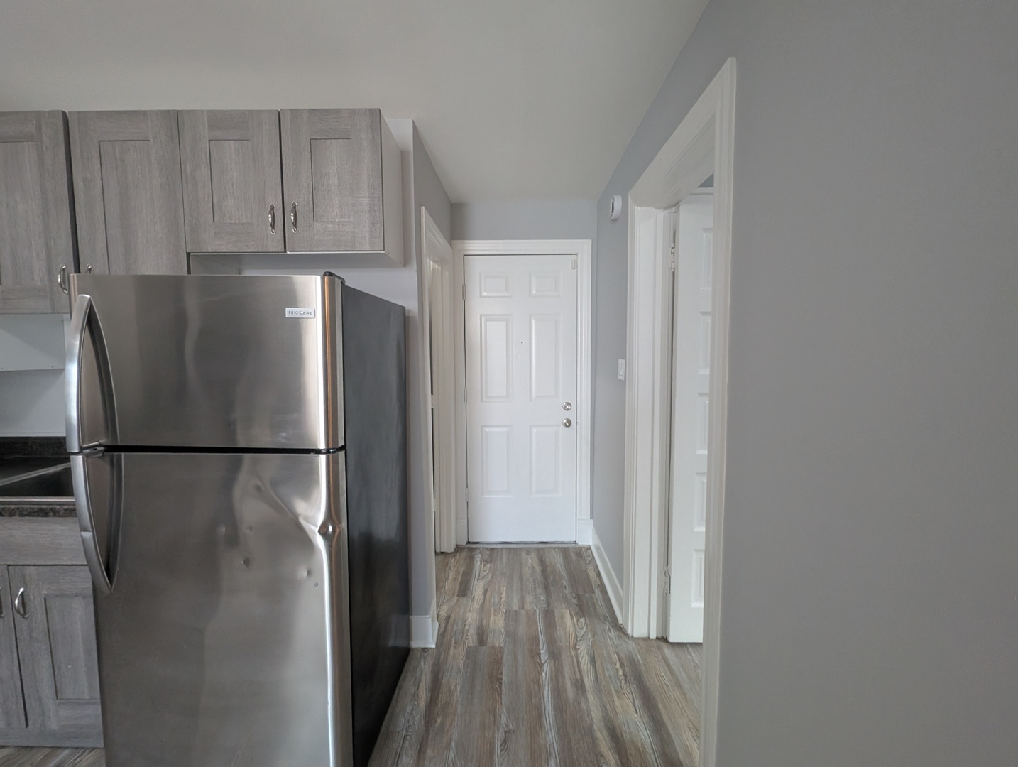 827 North Fairfield Avenue Chicago, IL 60622 - Photo 50 of 55 a white refrigerator freezer sitting in a kitchen