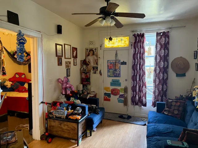 a bedroom with a bed and a lamp on the table