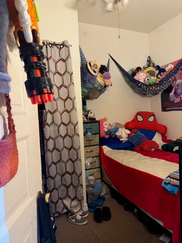 a view of a livingroom with furniture and a flat screen tv