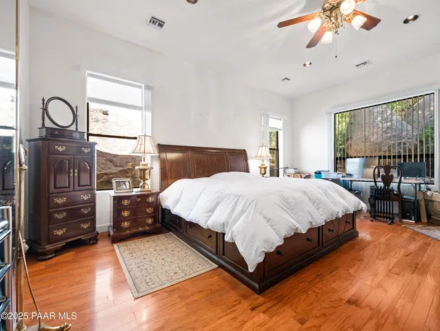 a bathroom with a sink a toilet and shower curtain