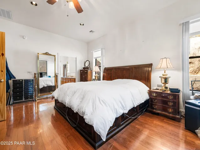 a white bath tub sitting in a bathroom next to a window