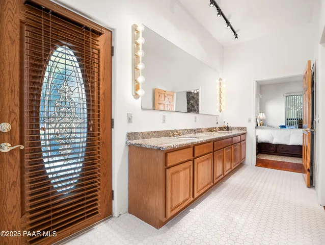 a room with gym equipment and wooden floor