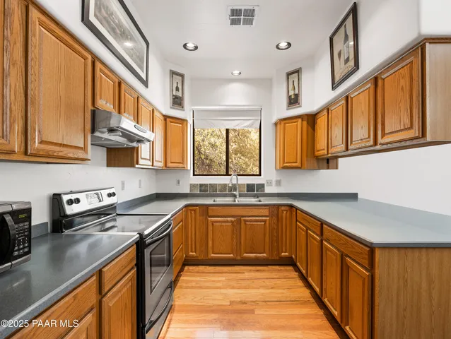 a bedroom with a bed and a tv on the dresser