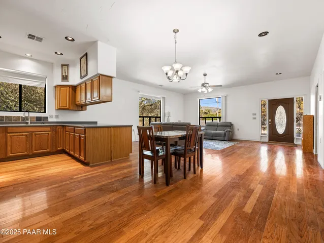 a view of a house with snow on the road