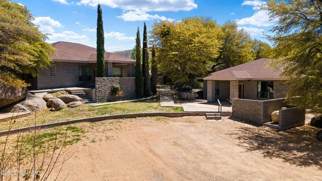 a view of a backyard of the house