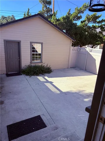 a view of a backyard of the house