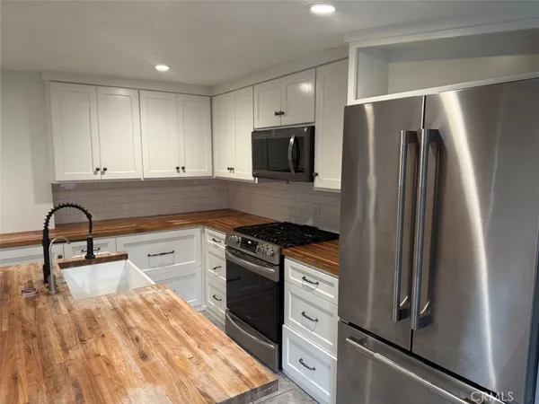 a hallway with washer and dryer