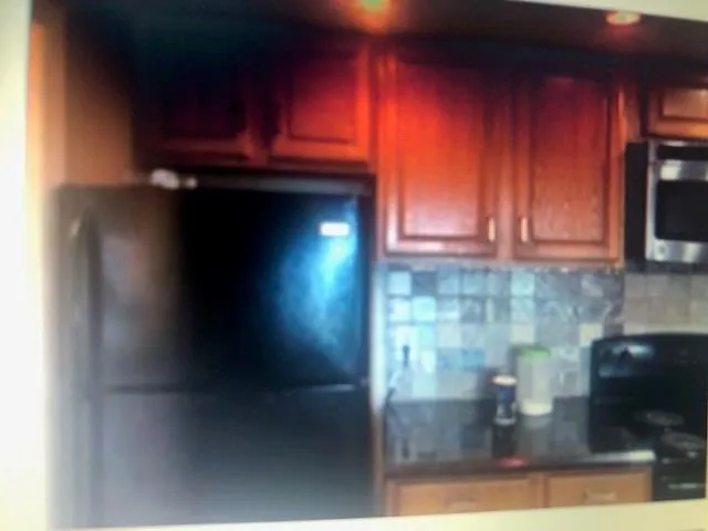 a kitchen with a stove and a microwave