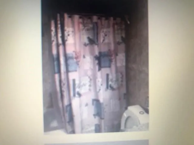 a view of an empty room and a window