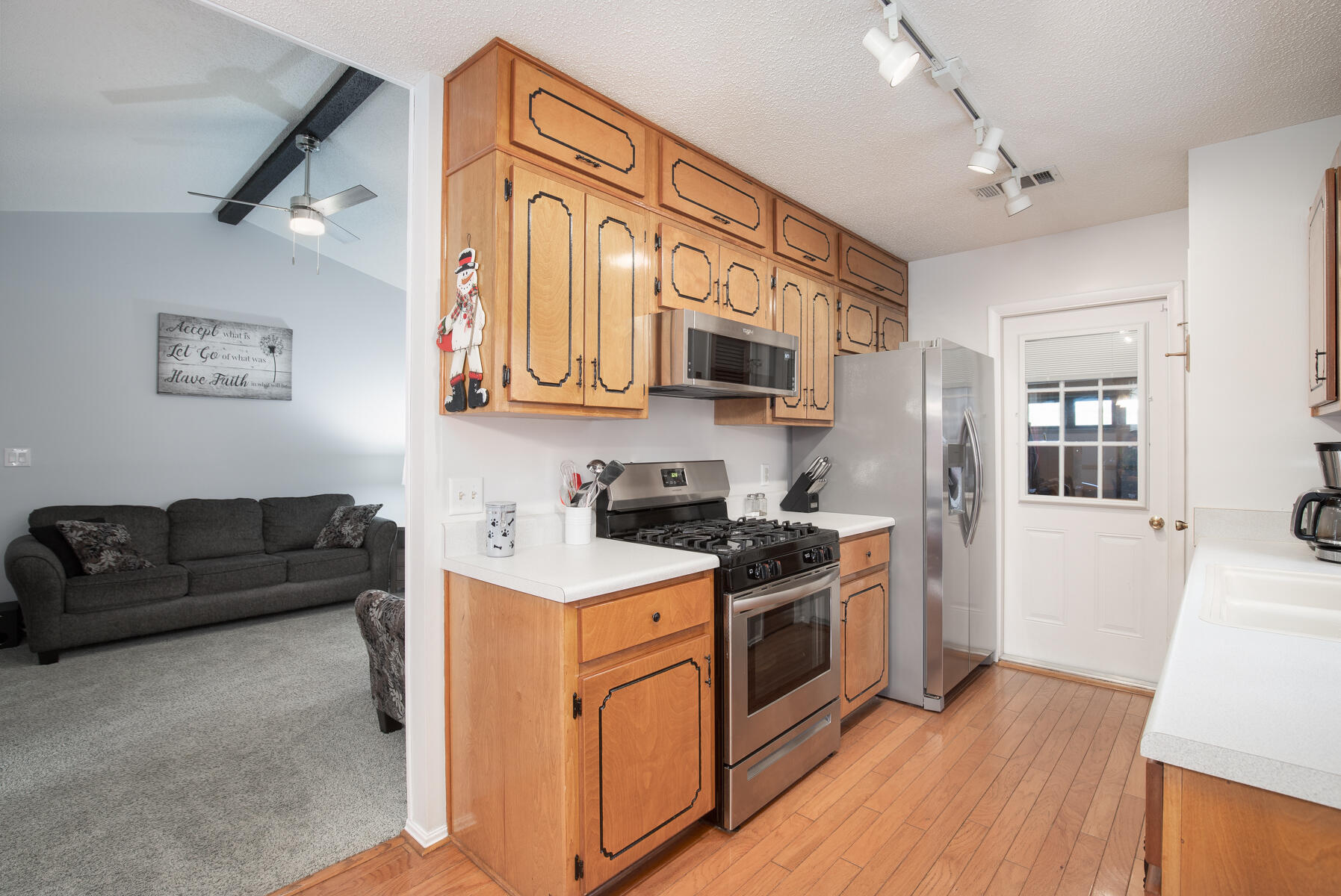 2826 Penney Lane Crestview, FL 32539 - Photo 11 of 22 a kitchen with stainless steel appliances granite countertop a stove a sink and a refrigerator