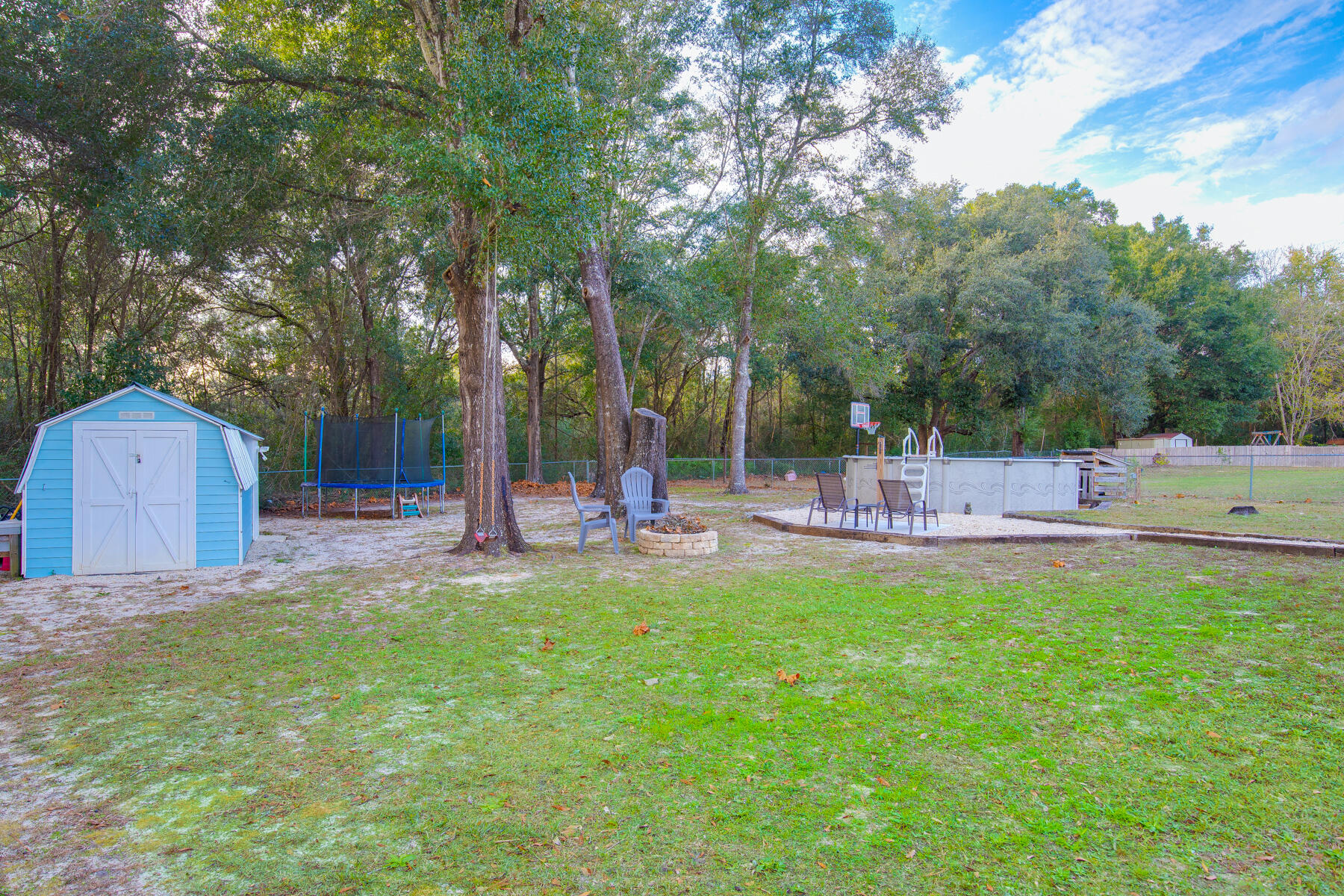 2826 Penney Lane Crestview, FL 32539 - Photo 19 of 22 a view of a park with bench and trees