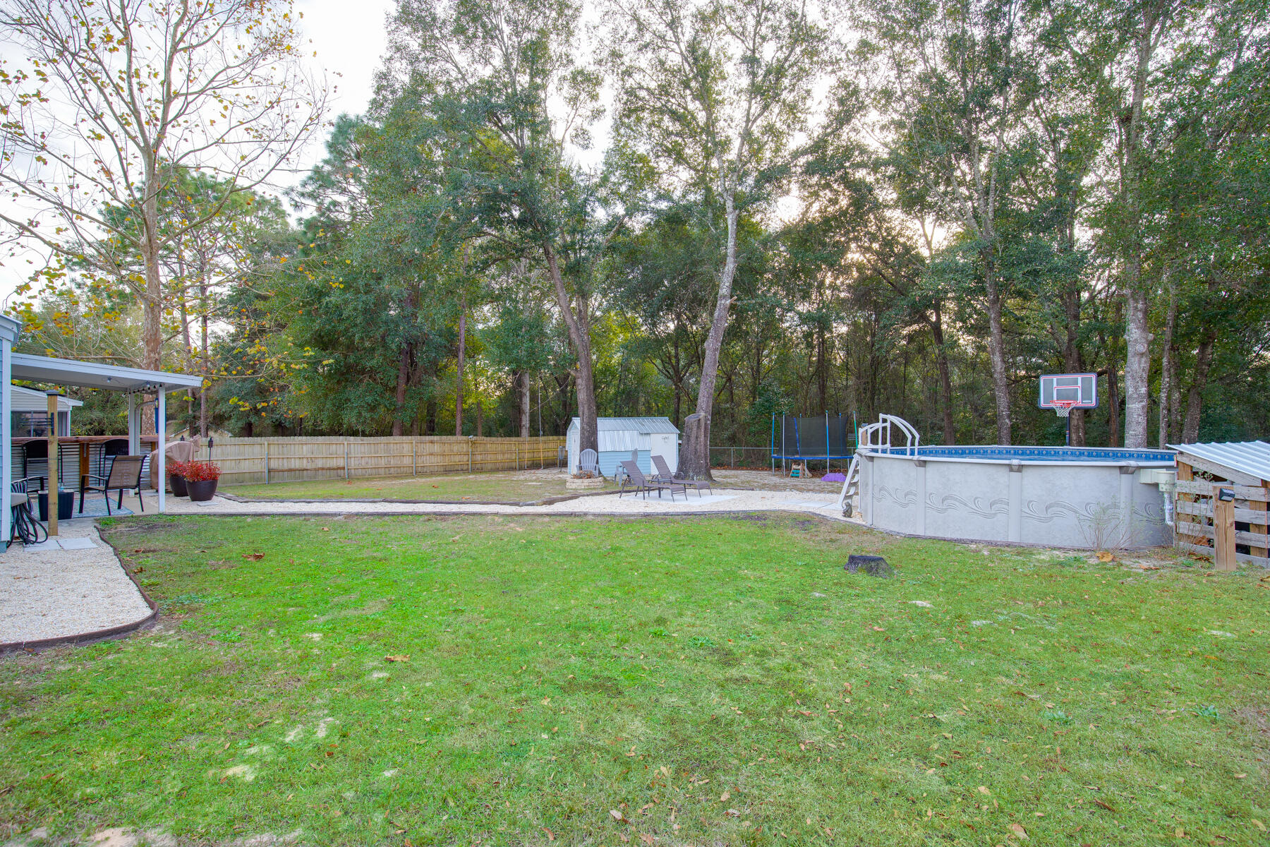 2826 Penney Lane Crestview, FL 32539 - Photo 20 of 22 a view of a garden and patio