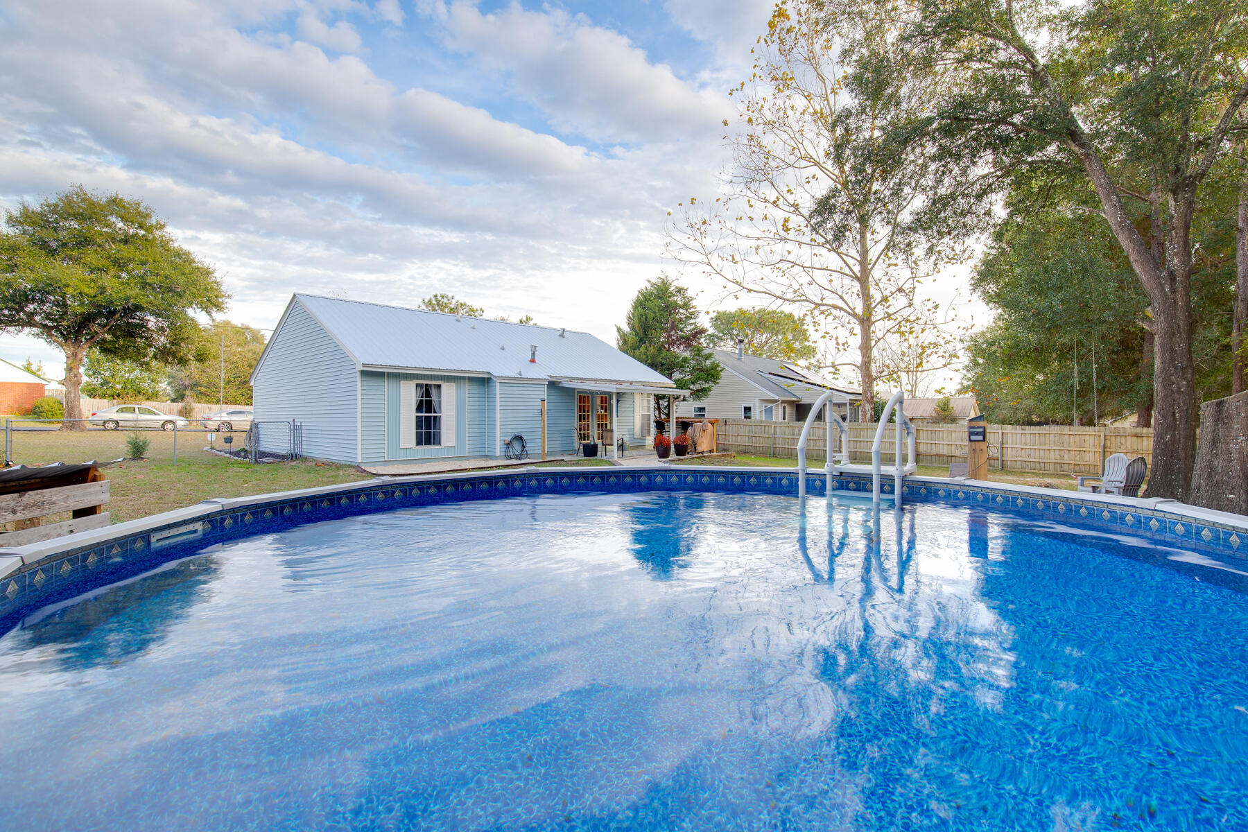 2826 Penney Lane Crestview, FL 32539 - Photo 21 of 22 a view of a house with pool and sitting area