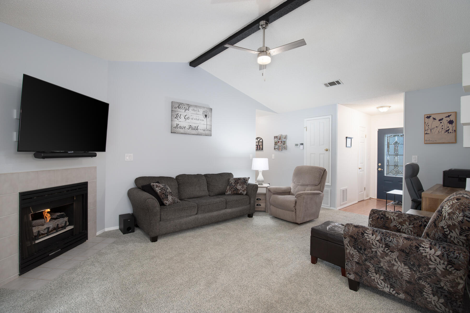 2826 Penney Lane Crestview, FL 32539 - Photo 6 of 22 a living room with furniture a fireplace and a flat screen tv
