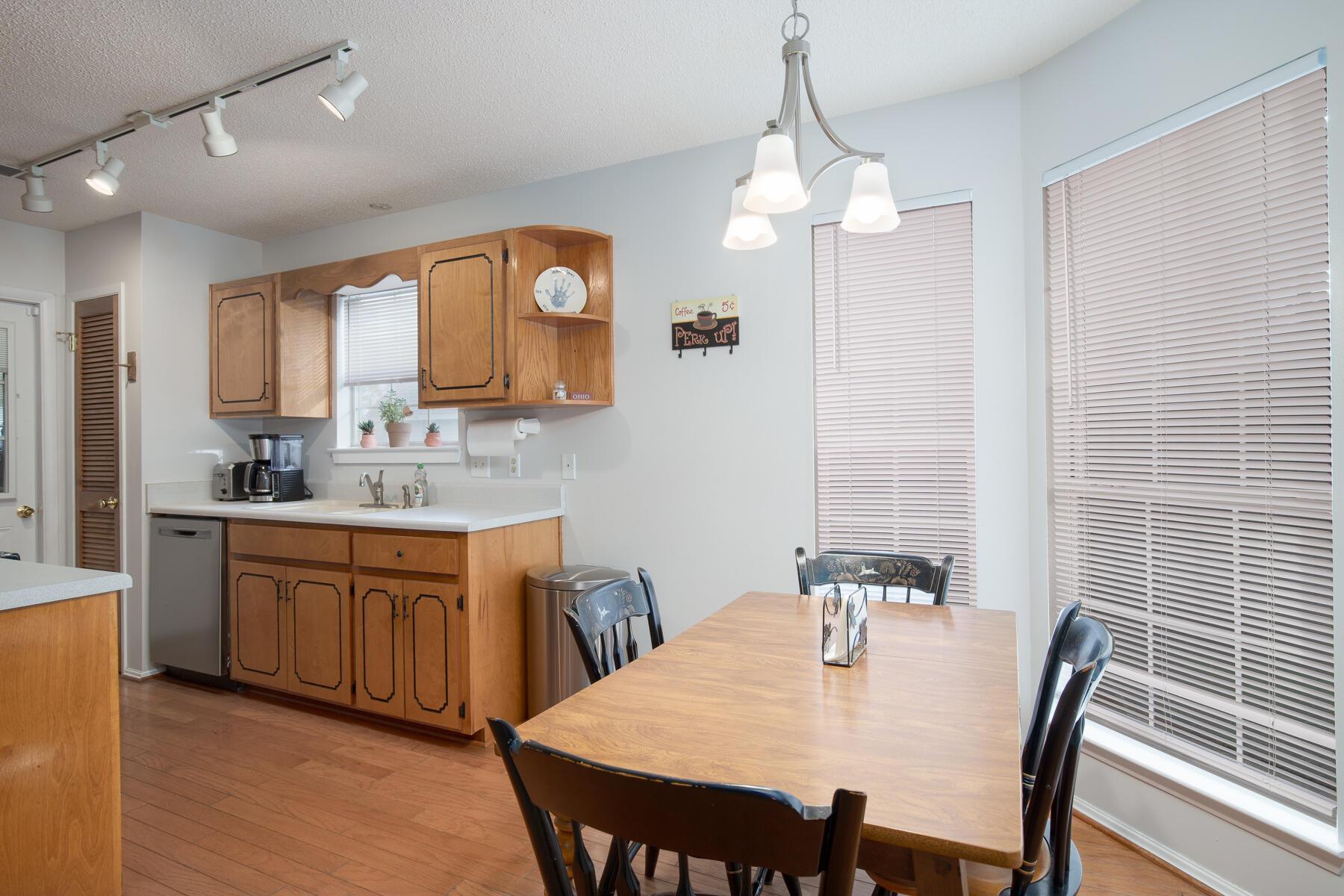 2826 Penney Lane Crestview, FL 32539 - Photo 8 of 22 a view of a dining room with furniture and wooden floor