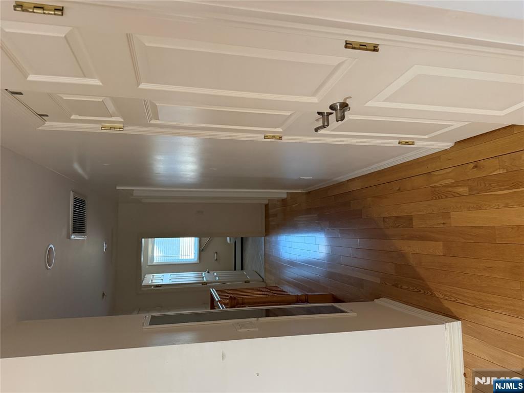 37 Park Row, Unit 2 Wallington, NJ 07057 - Photo 11 of 33 a view of a hallway with wooden floor and staircase