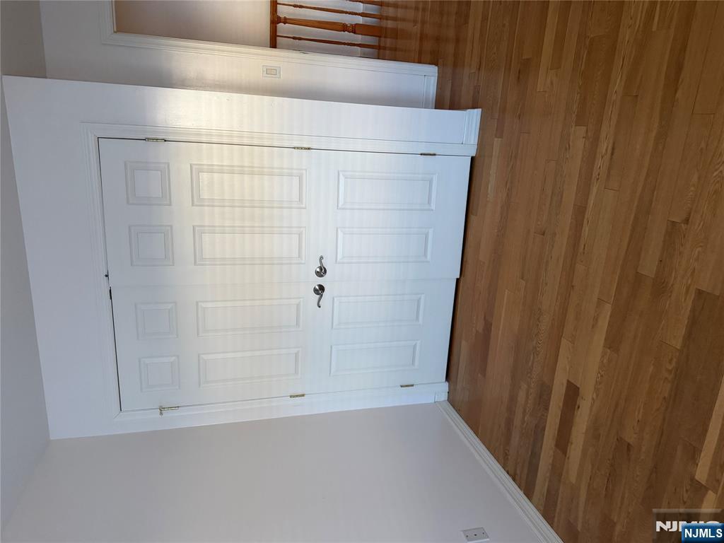 37 Park Row, Unit 2 Wallington, NJ 07057 - Photo 13 of 33 a view of an empty room with wooden floor