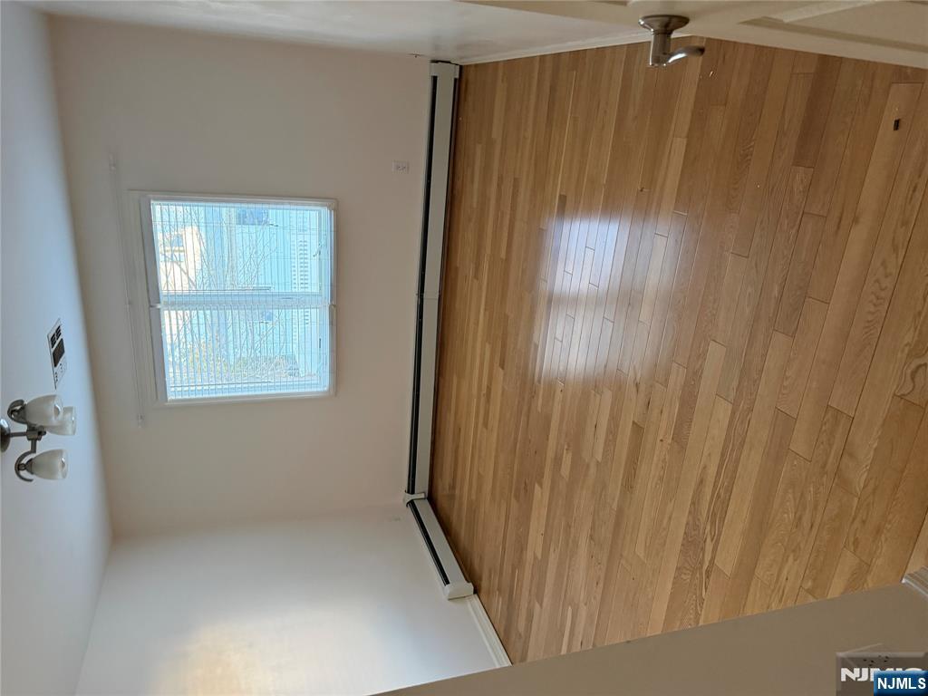37 Park Row, Unit 2 Wallington, NJ 07057 - Photo 15 of 33 a view of a room with wooden floor