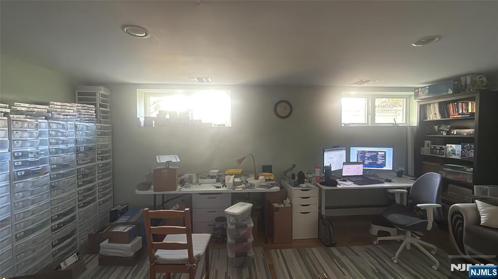 37 Park Row, Unit 2 Wallington, NJ 07057 - Photo 2 of 33 a view of a workspace with furniture and a window