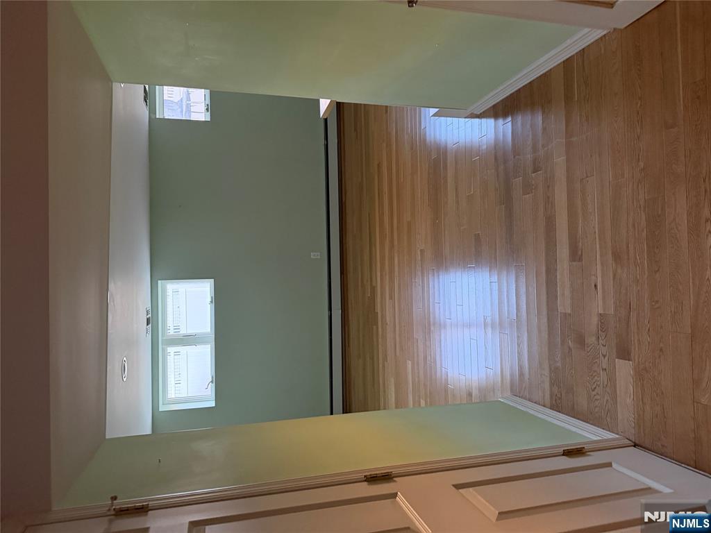 37 Park Row, Unit 2 Wallington, NJ 07057 - Photo 21 of 33 a view of room with window and wooden floor