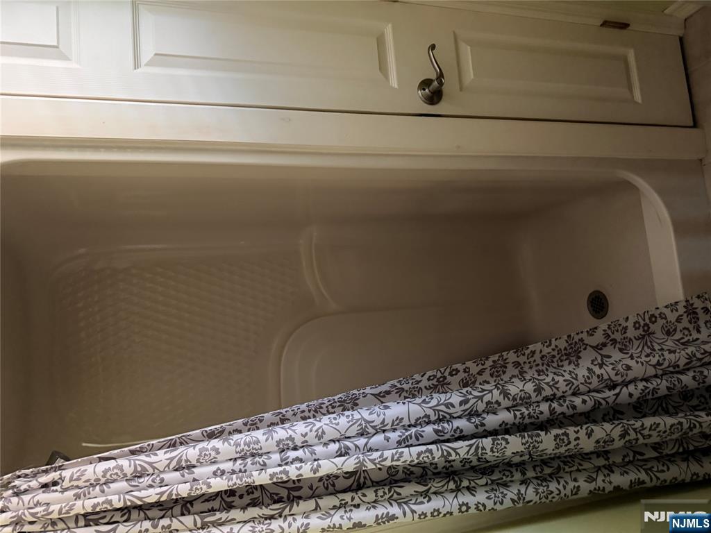 37 Park Row, Unit 2 Wallington, NJ 07057 - Photo 23 of 33 a bathroom with a bathtub