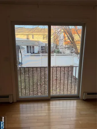 a view of balcony with wooden fence