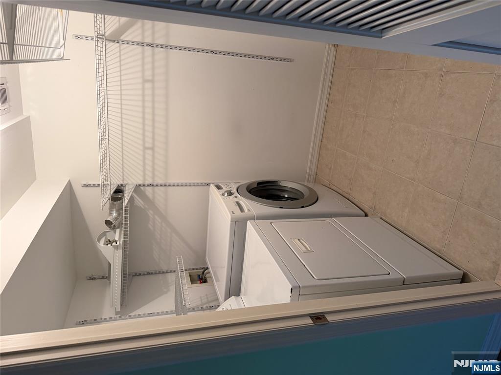 37 Park Row, Unit 2 Wallington, NJ 07057 - Photo 29 of 33 a utility room with dryer and washer
