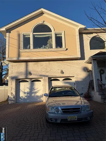 a car parked in front of a house