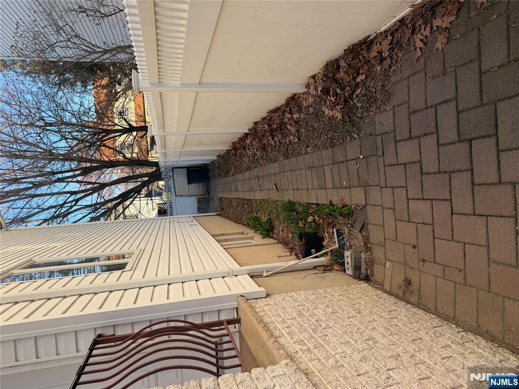 37 Park Row, Unit 2 Wallington, NJ 07057 - Photo 5 of 33 a view of a pathway with a white house