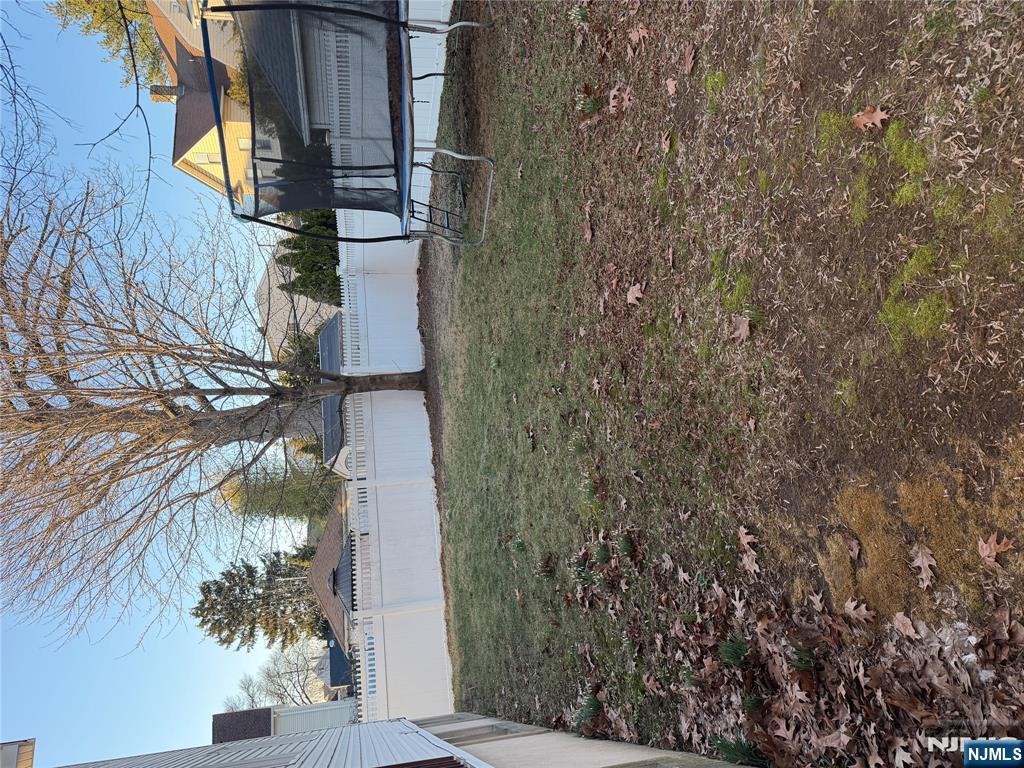 37 Park Row, Unit 2 Wallington, NJ 07057 - Photo 6 of 33 a view of backyard with green space