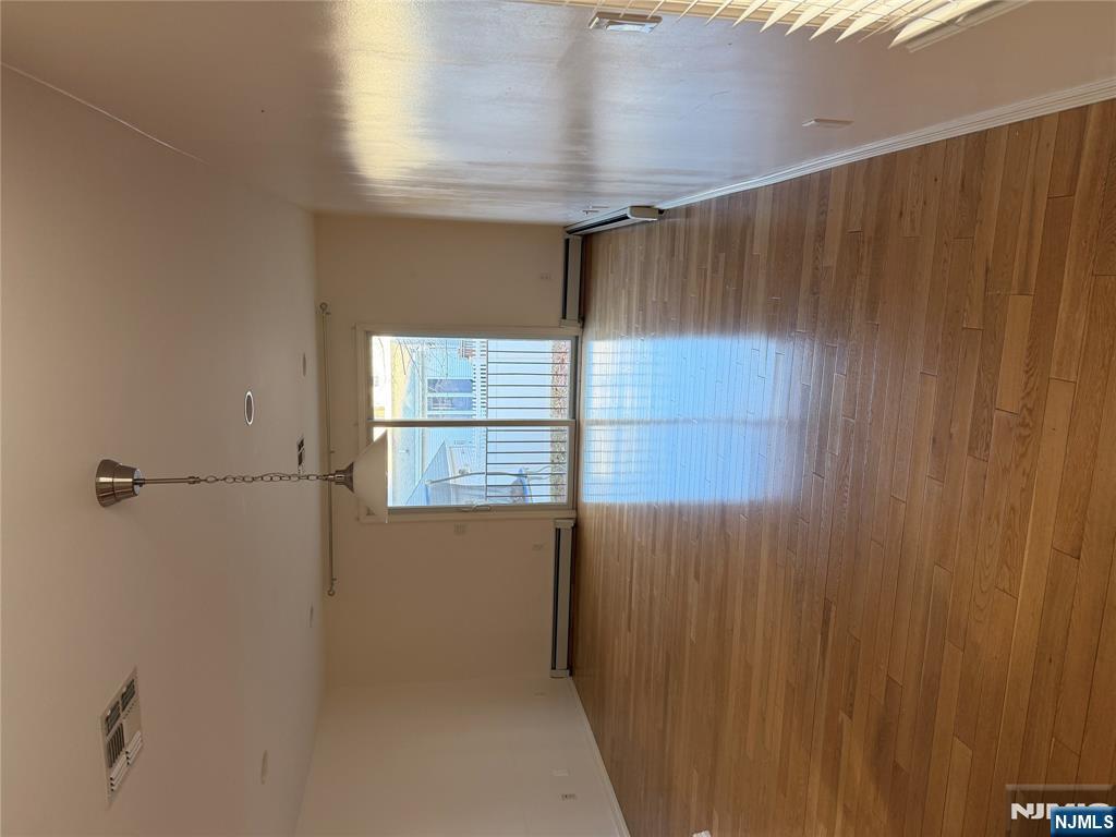 37 Park Row, Unit 2 Wallington, NJ 07057 - Photo 7 of 33 a view of empty room with wooden floor