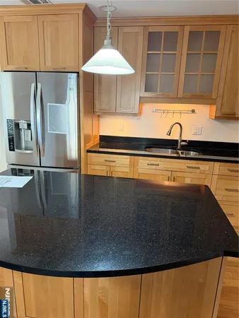 a close view of sink and cabinets