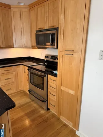 a kitchen with a stove microwave and sink