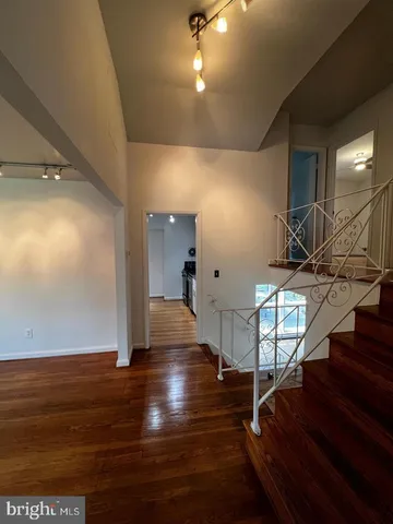 a view of entryway with wooden floor