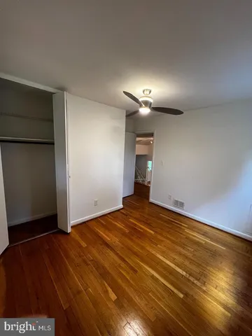 a bathroom with a toilet a sink and a window