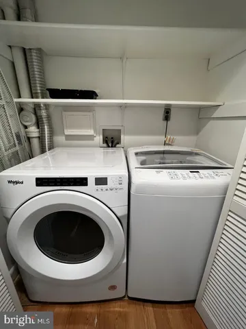 a view of hallway with wooden floor