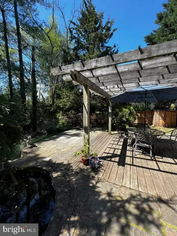 a view of a backyard with large trees