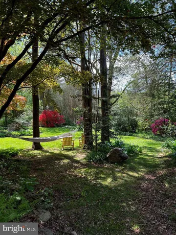 a backyard of a house with lots of green space