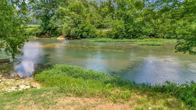 a view of a lake with a yard
