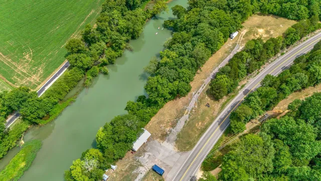 a view of a lake with a yard