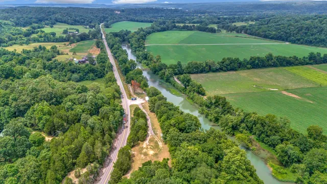 an aerial view of a houses with a lake view