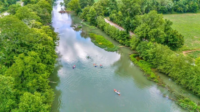 a view of a lake with a yard