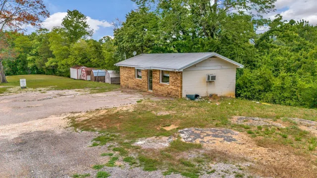 a fire hydrant in the middle of a green field