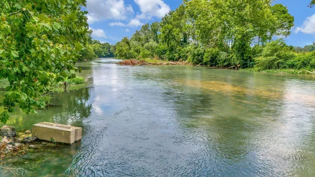 a view of a lake with a yard